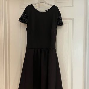 Girls dress with black rhinestone on shoulder